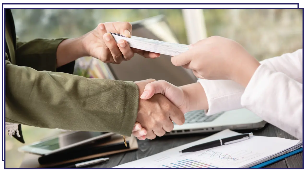 men shaking hands - software development company registration in Bahrain